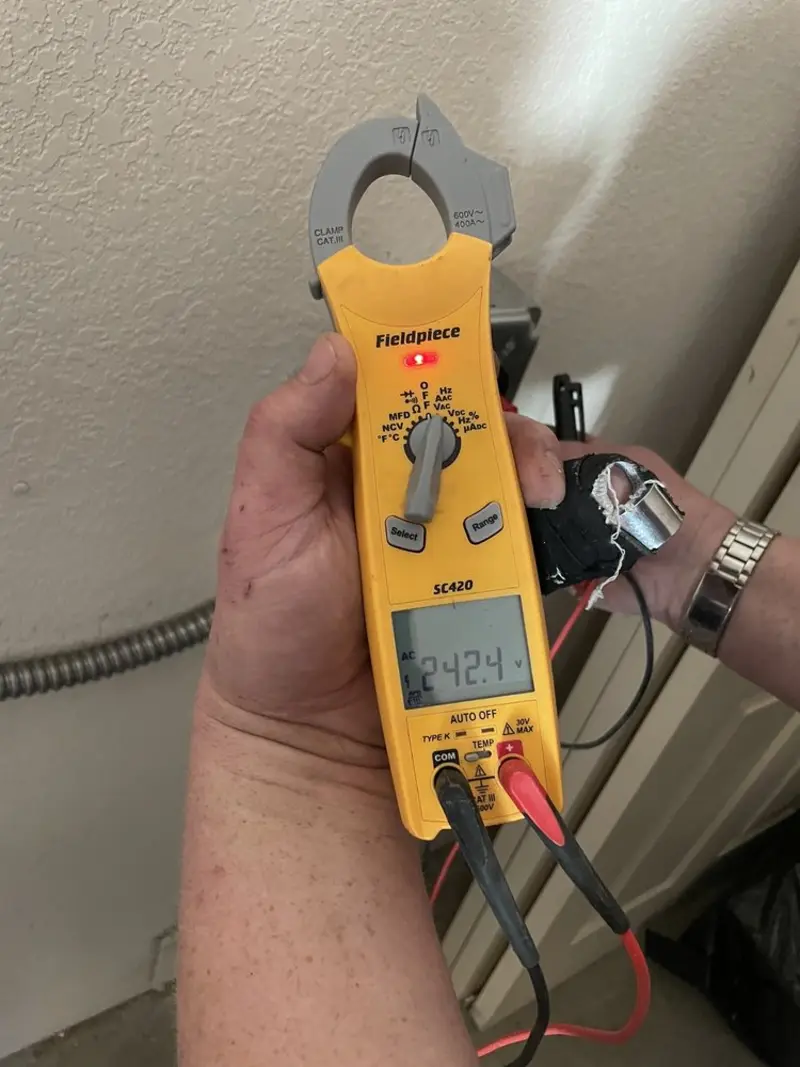 Voltage testing with clamp meter during Ceiling Fan Installation in York